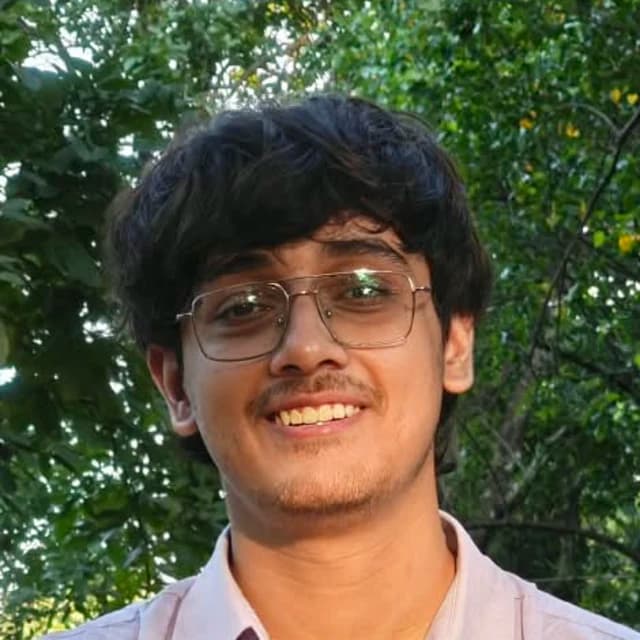 Krishnava Ghosh, smiling, outdoors